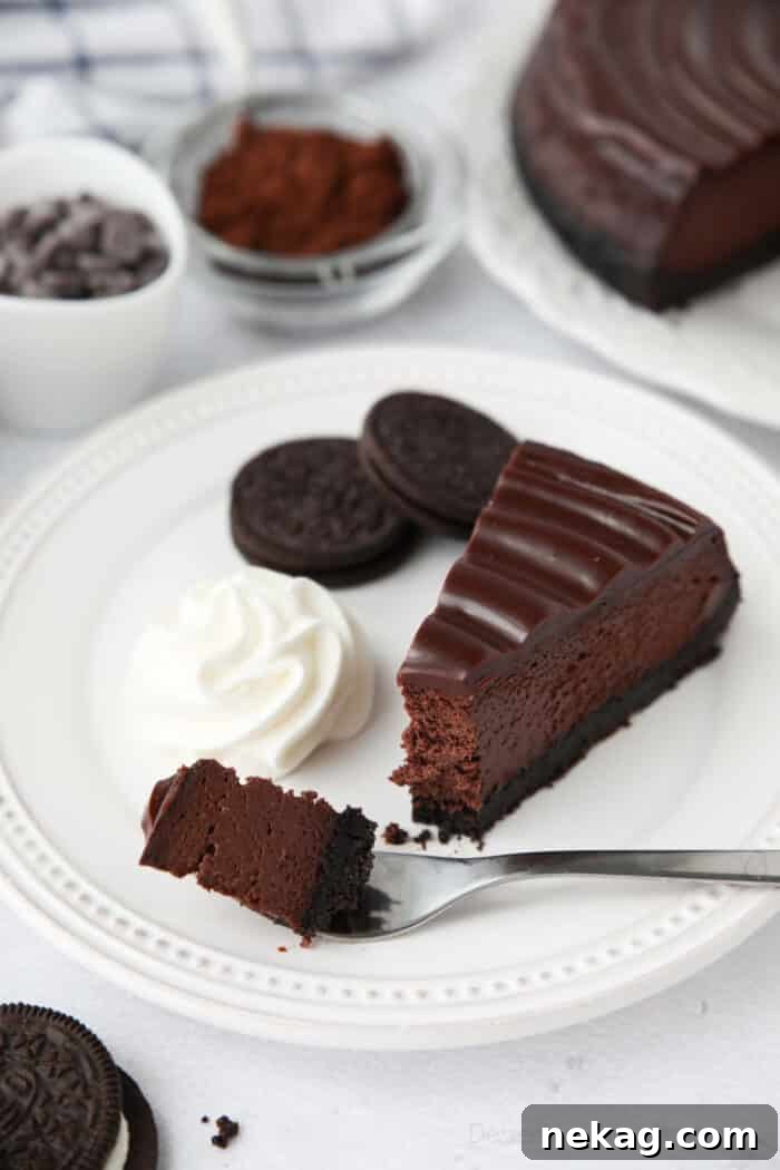Triple Chocolate Cheesecake on a fork ready to be eaten.