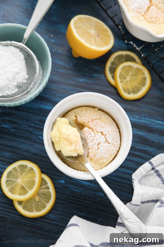 Light and Luscious Lemon Pudding Cake Recipe 2 Spoonful of lemon pudding cake in ramekin.