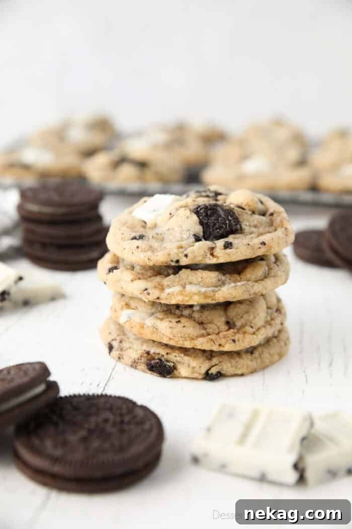 Cookies & Cream Sandwich Cookies: Homemade Oreo-Style Recipe 4 Four cookies and cream cookies stacked on top of each other.