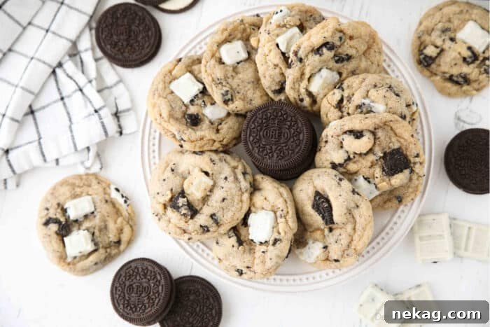 Cookies & Cream Sandwich Cookies: Homemade Oreo-Style Recipe 5 Plate of cookies and cream cookies with a stack of Oreos in the middle.