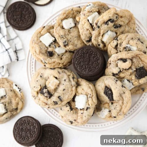 Cookies & Cream Sandwich Cookies: Homemade Oreo-Style Recipe 9 Plate of cookies and cream cookies with a stack of Oreos in the middle.