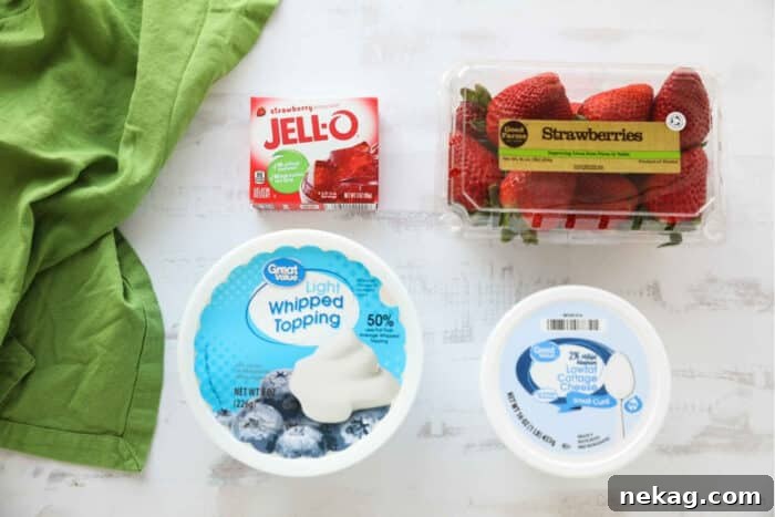 Light and Creamy Strawberry Fluff Dessert Recipe 5 Strawberry Fluff ingredients: Strawberry Jello (gelatin), fresh strawberries, whipped topping (Cool Whip), and cottage cheese.