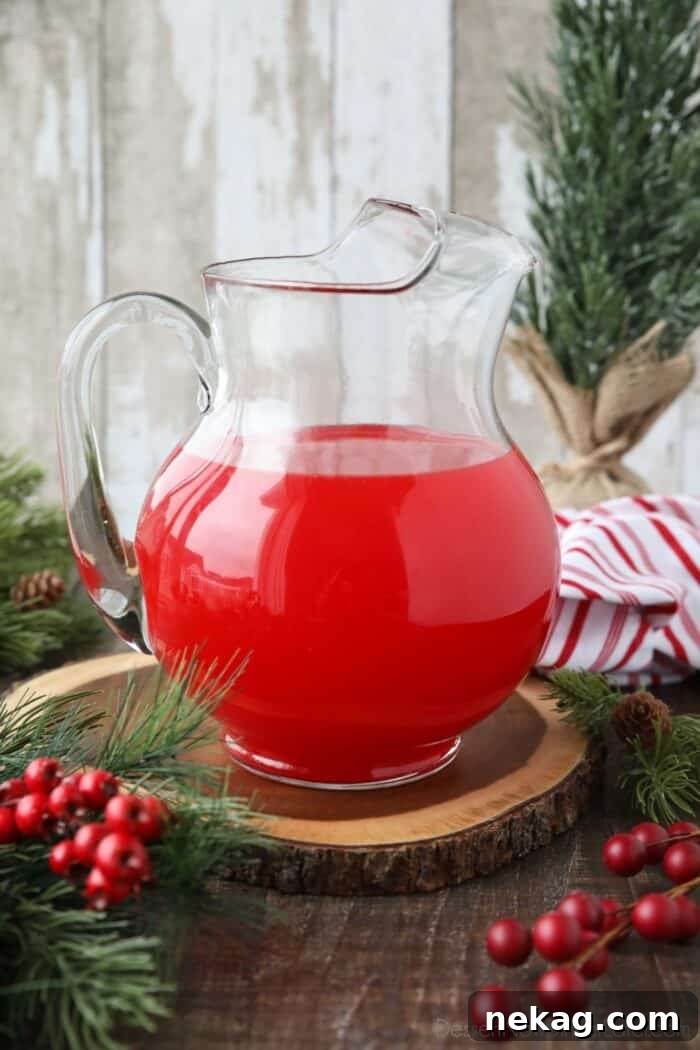 Pitcher with red Christmas punch.
