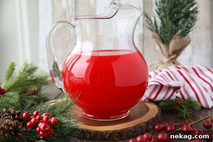 Pitcher of red non-alcoholic holiday punch.