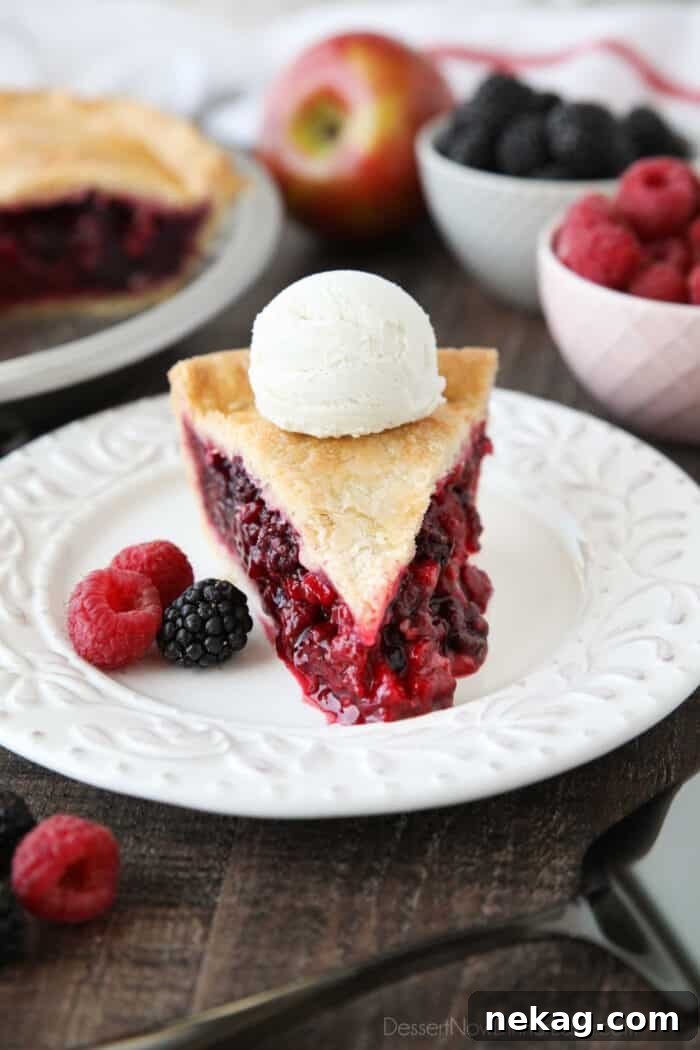 Razzleberry Pie Recipe with Step-by-Step Video Tutorial 12 Slice of Razzleberry Pie with a scoop of vanilla ice cream on top.