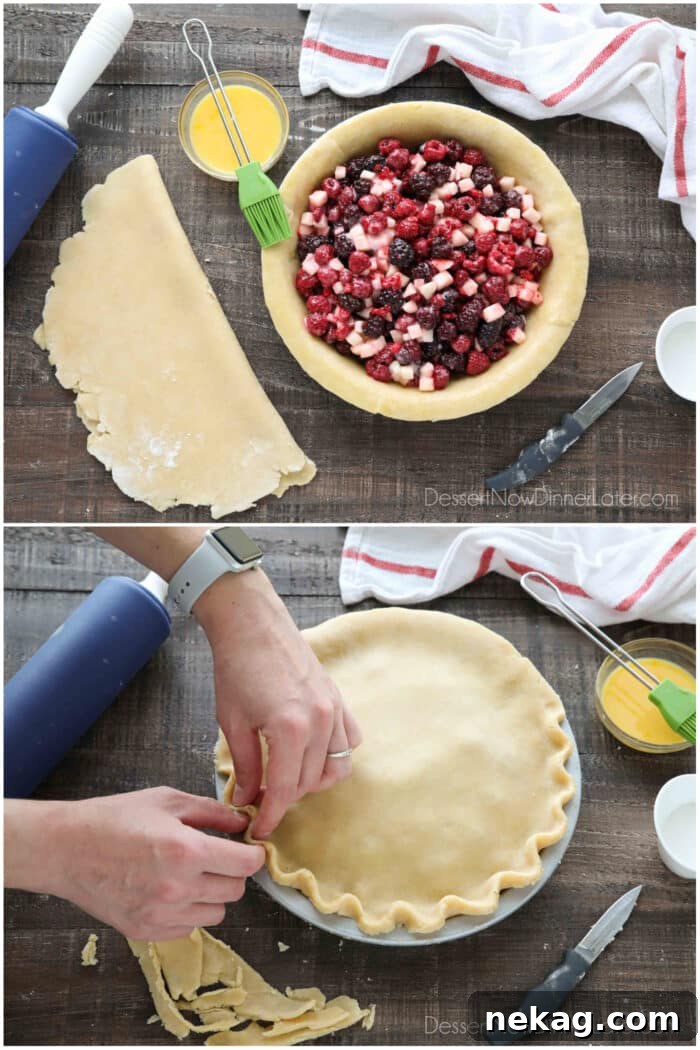 Razzleberry Pie Recipe with Step-by-Step Video Tutorial 10 Collage image. Top image: Whisked egg brushed on the edges of the pie crust. More pie crust on surface next to pie, rolled and folded to be put on top. Bottom image: Top crust assembled, and edges being crimped together with two hands.