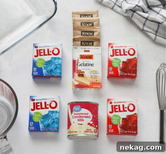 Patriotic Red, White & Blue Jello Dessert Recipe 5 Ingredients for red white and blue jello. 2 small boxes of Berry Blue Jello, two small boxes Strawberry Jello, 4 packets Knox Gelatine, 1 can Sweetened Condensed Milk, and boiling water.