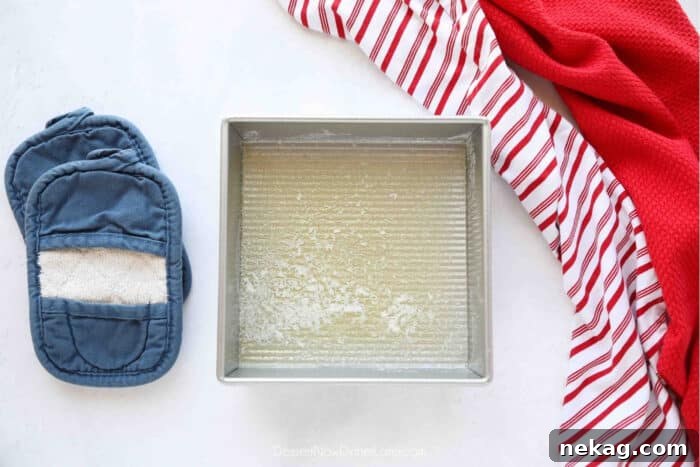 Classic Cherry Cobbler Recipe with Golden Biscuit Topping 7 Melted butter in a square baking dish.