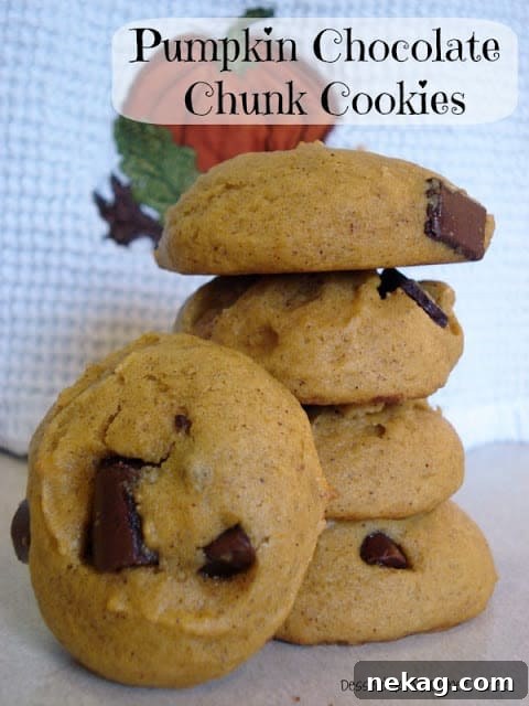 Pumpkin Chocolate Chunk Cookies Recipe — Soft, Chewy Fall Treat 11 Stack of pumpkin cookies with chocolate chunks.