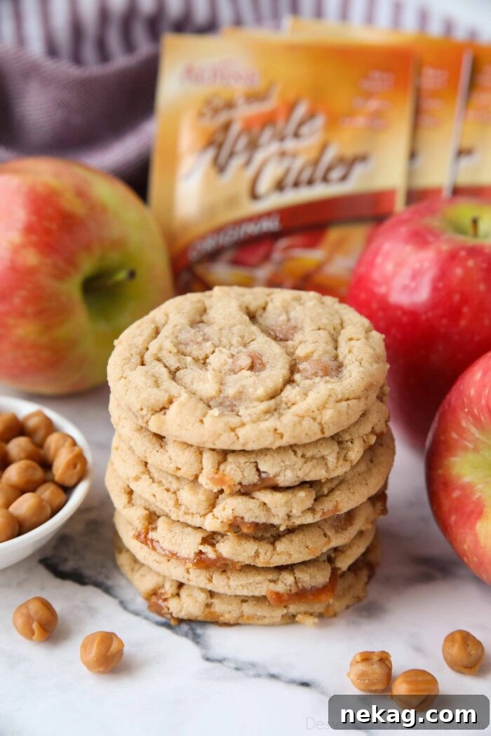 Caramel Apple Cider Cookies Recipe for Cozy Fall Baking 2 Stack of apple cider cookies with caramel bits.