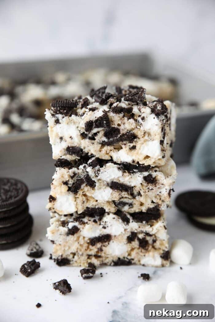 Oreo Rice Krispie Treats Recipe: Chewy Chocolate Marshmallow Squares 2 Stack of Oreo rice krispie treats with extra marshmallows and chunks of Oreo cookies.