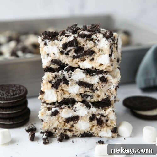 Oreo Rice Krispie Treats Recipe: Chewy Chocolate Marshmallow Squares 11 Stack of Oreo rice krispie treats with extra marshmallows and chunks of Oreo cookies.