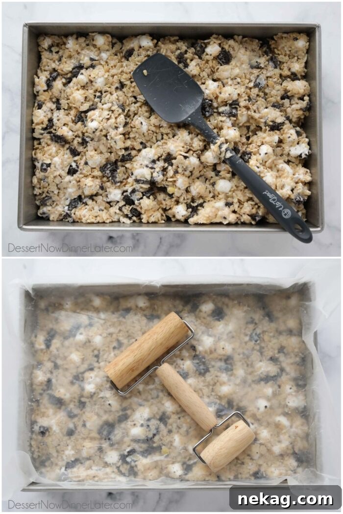 Oreo Rice Krispie Treats Recipe: Chewy Chocolate Marshmallow Squares 6 Spreading Oreo rice krispie treats in a pan and flattening the top.