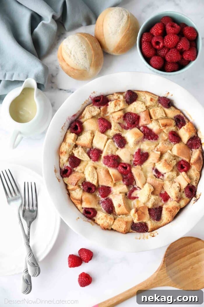 Creamy Raspberry Bread Pudding Recipe with Vanilla Sauce 3 Top view of baked raspberry bread pudding aka baked french toast with raspberries.