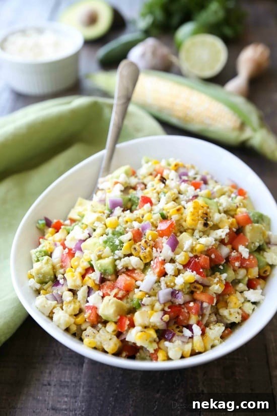 This summer Corn Salad with Queso Fresco is loaded with grilled corn, crisp onions and peppers, and creamy avocado, all topped with a homemade cilantro lime vinaigrette and generous helping of delicious queso fresco.