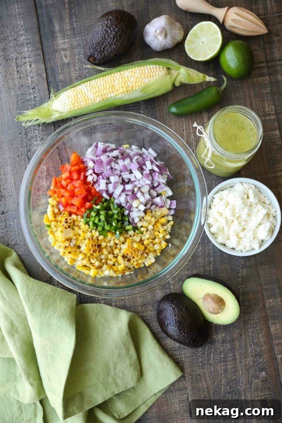 This summer Corn Salad with Queso Fresco is loaded with grilled corn, crisp onions and peppers, and creamy avocado, all topped with a homemade cilantro lime vinaigrette and generous helping of delicious queso fresco.