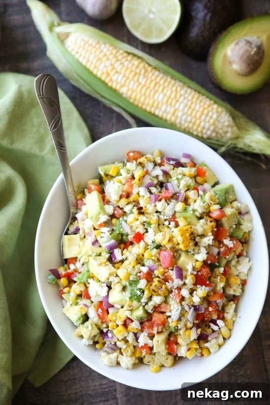 This summer Corn Salad with Queso Fresco is loaded with grilled corn, crisp onions and peppers, and creamy avocado, all topped with a homemade cilantro lime vinaigrette and generous helping of delicious queso fresco.