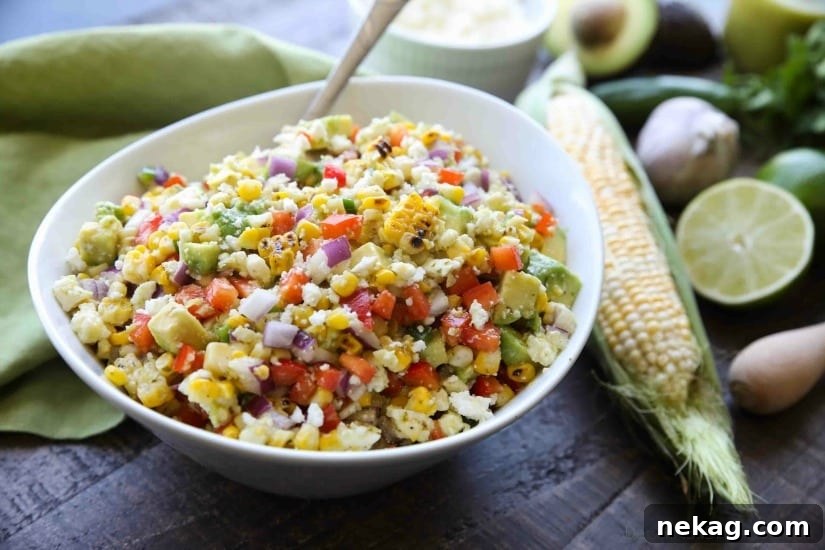 This summer Corn Salad with Queso Fresco is loaded with grilled corn, crisp onions and peppers, and creamy avocado, all topped with a homemade cilantro lime vinaigrette and generous helping of delicious queso fresco.