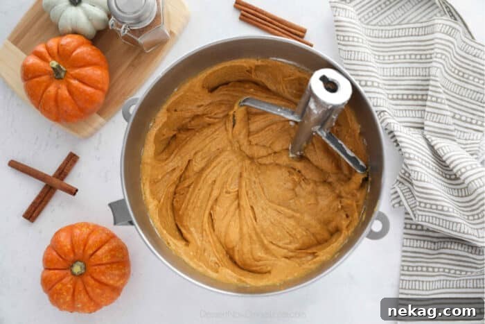 Moist Pumpkin Bundt Cake with Warm Spice Glaze 7 Pumpkin cake batter in mixing bowl.