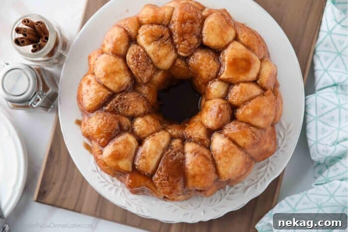 Soft Pull-Apart Monkey Bread Recipe with Video Tutorial 11 Top view of sticky warm monkey bread on a plate.