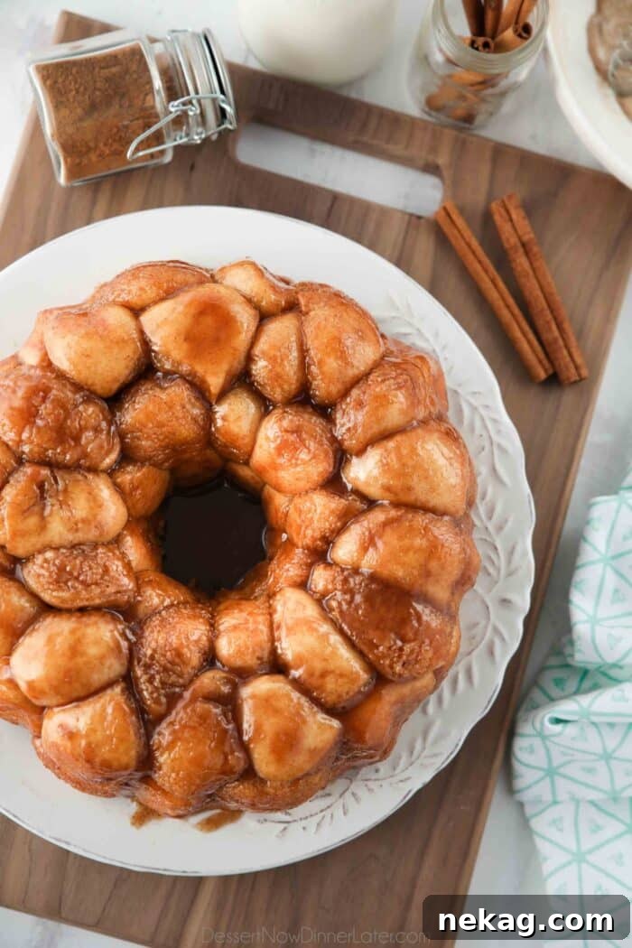 Soft Pull-Apart Monkey Bread Recipe with Video Tutorial 4 Top view of gooey monkey bread on a plate.