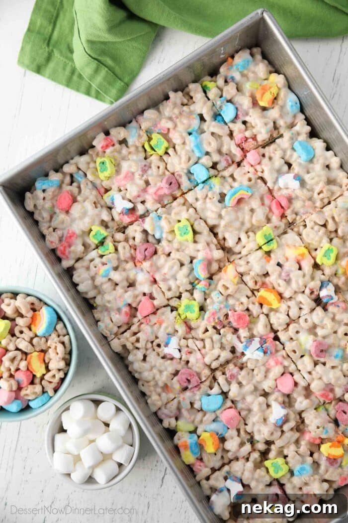 How to Make Irresistible Lucky Charms Treats at Home 3 Top view of a pan of marshmallow treats made with Lucky Charms cereal.