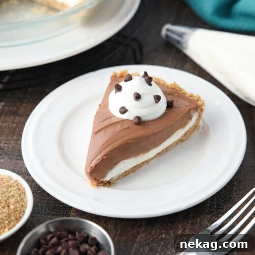 Decadent Chocolate Cream Cheese Pie Recipe for Chocolate Lovers 10 Slice of Chocolate Cream Cheese Pie on a plate with whipped cream and mini chocolate chips.