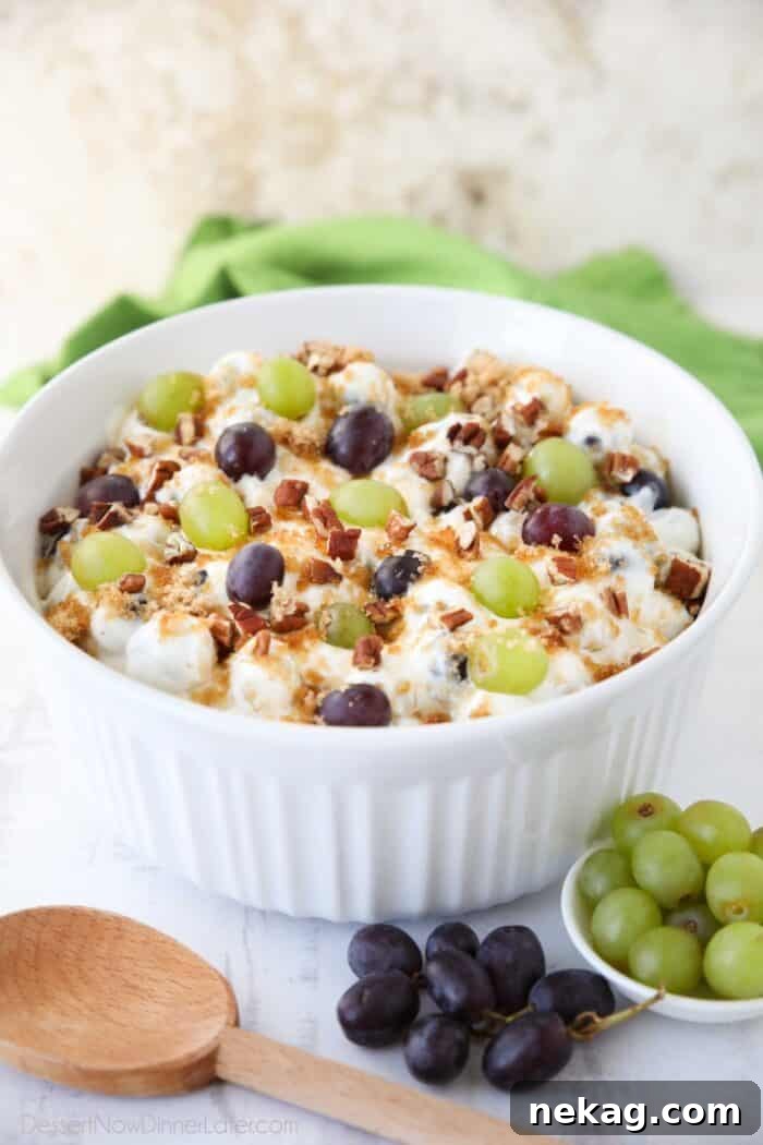 Creamy Grape Salad Recipe with Crunchy Pecans and Sweet Dressing 4 Large serving bowl full of grape salad.