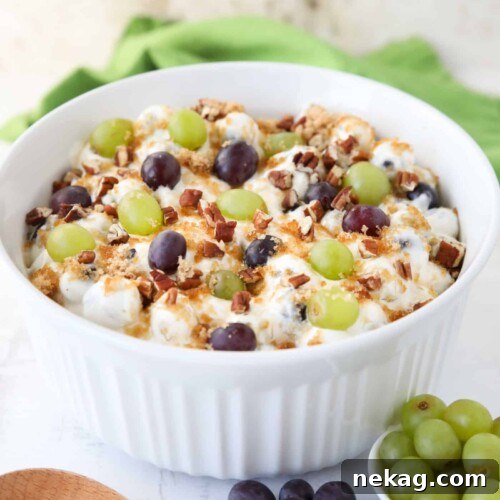 Creamy Grape Salad Recipe with Crunchy Pecans and Sweet Dressing 9 Large serving bowl full of grape salad.