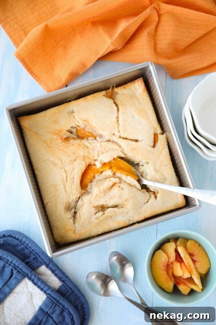 Homemade Peach Cobbler with Golden Biscuit Topping 3 Baked peach cobbler made with canned peaches.