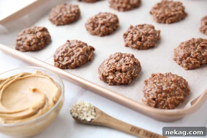 No bake cookies set up on baking tray with wax paper.