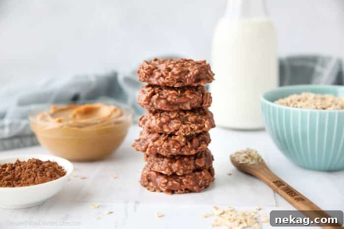 Chocolate peanut butter no bake cookies stacked on top of each other.