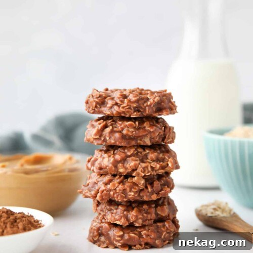 Easy no bake cookies made with peanut butter and chocolate stacked high.