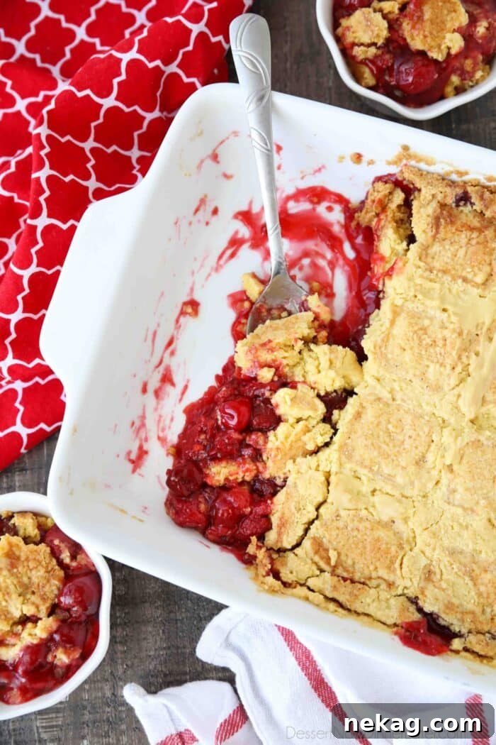 Classic Cherry Dump Cake Recipe for Quick Summer Desserts 3 Baking pan of cherry pie filling with yellow cake baked on top. Aka cherry dump cake.