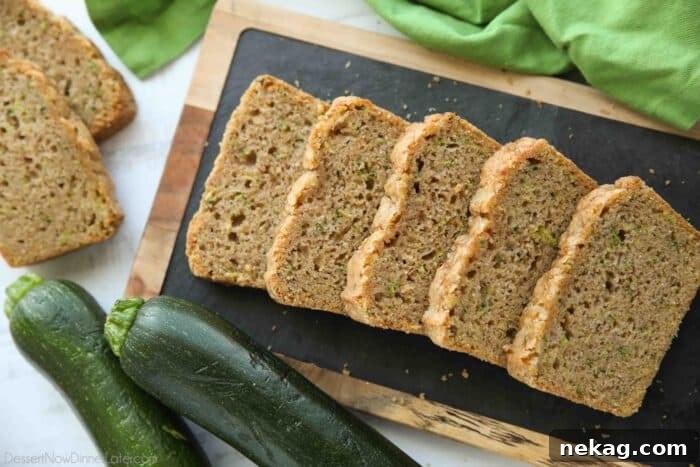 Sliced zucchini bread on a tray.