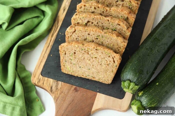Sliced zucchini bread on a tray.