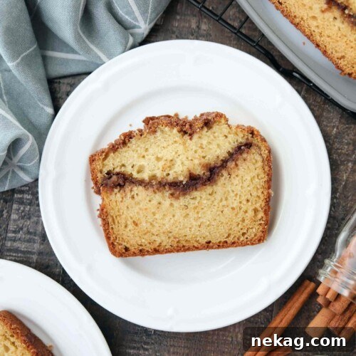 Ultimate Cinnamon Quick Bread Recipe — Moist & Spiced Loaf 12 Slice of loaf cake with a cinnamon swirl center.