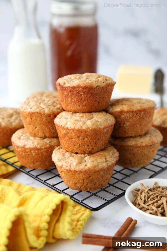 All Bran Muffins stacked on a wire cooling rack.