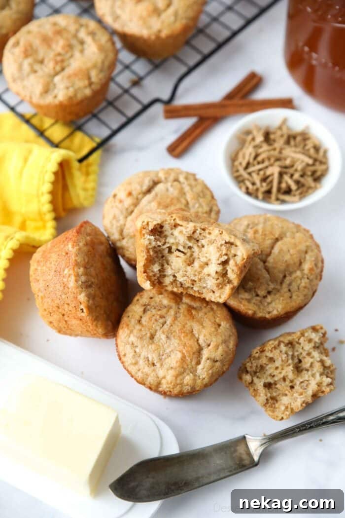 Muffins made with All-Bran cereal, with one muffin showing the light and fluffy interior texture.