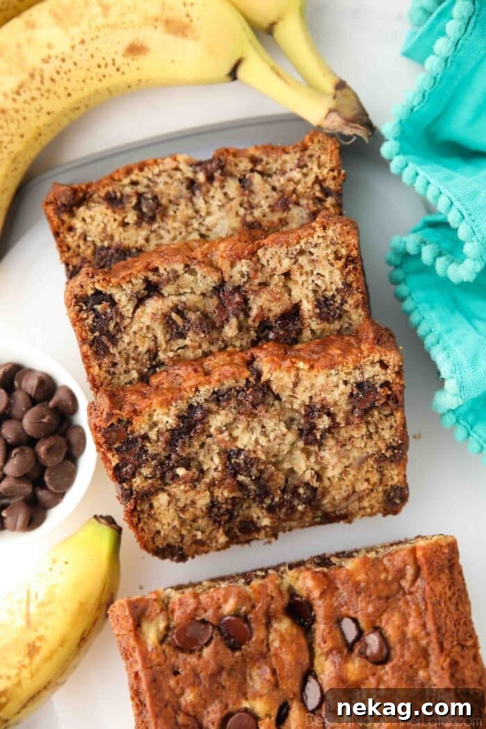 Chocolate Chip Banana Bread Recipe with Melted Chocolate Chunks 2 Slices of banana bread with chocolate chips inside.