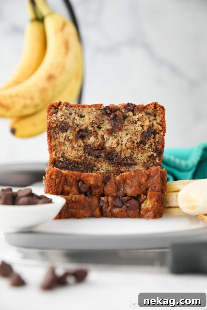 Chocolate Chip Banana Bread Recipe with Melted Chocolate Chunks 4 Banana Bread cut open to show chocolate chips inside.