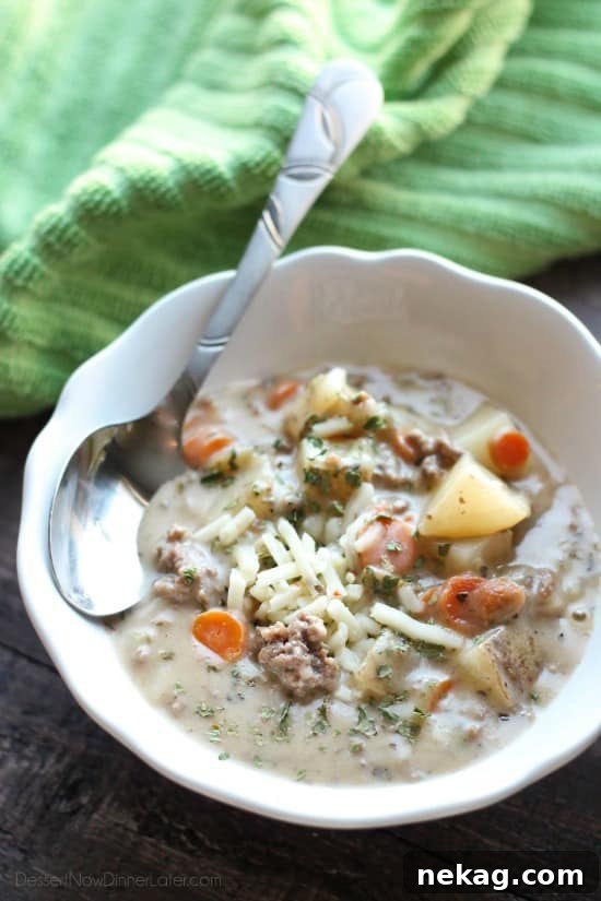 Creamy cheeseburger soup with vegetables, beef, and pepper jack cheese