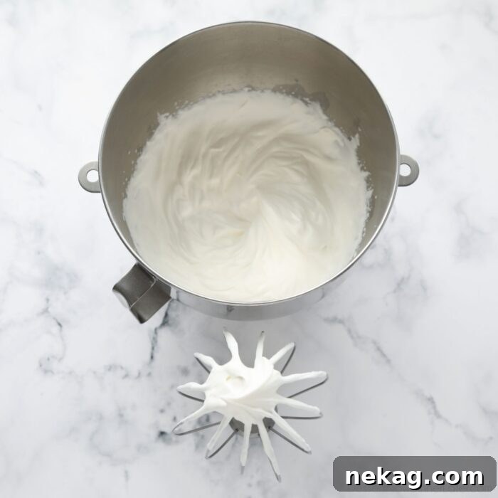 Flaky Biscuit Strawberry Shortcake Recipe You’ll Love 8 Whipped cream in a bowl with a whisk.