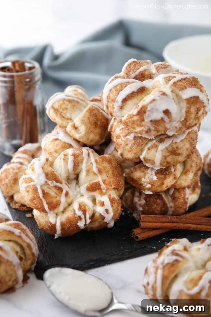 Stack of cinnamon knots with icing drizzled on top.