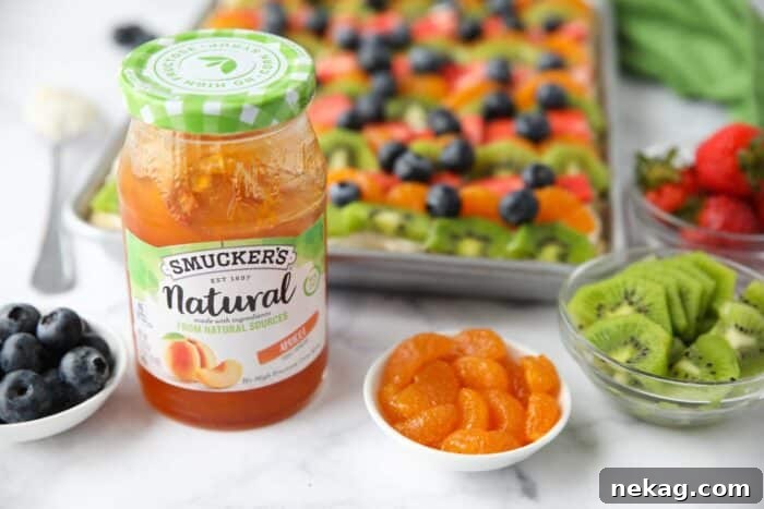 Apricot jam to glaze the fruit on top of the sugar cookie fruit pizza.