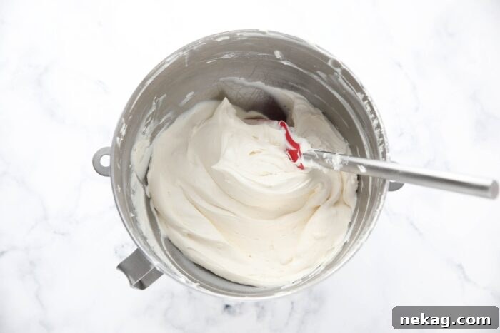 Bowl of whipped cream cheese frosting.