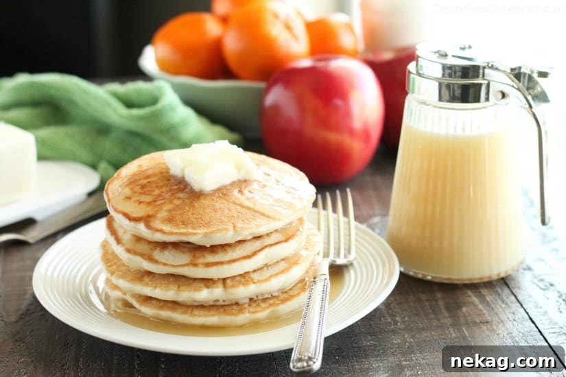 Blonde Butter Syrup poured over a stack of pancakes