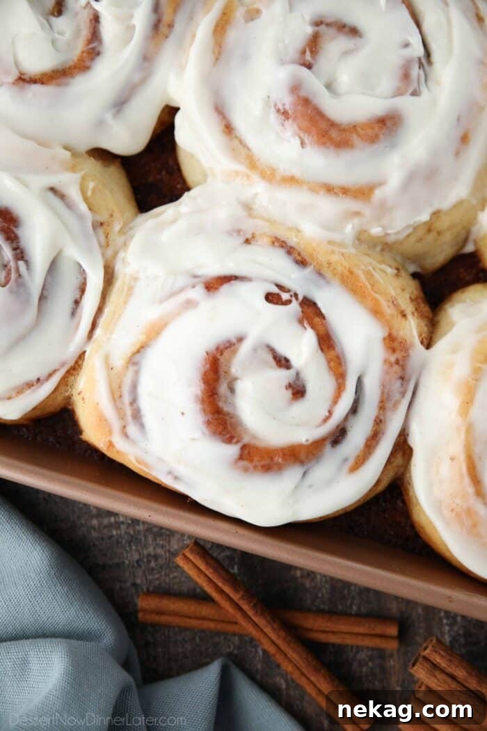 Homemade Cinnamon Rolls with Gooey Cream Cheese Frosting 2 Close-up of the best cinnamon rolls with cream cheese frosting in pan.