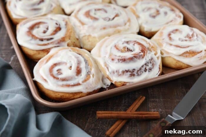 Homemade Cinnamon Rolls with Gooey Cream Cheese Frosting 13 The best cinnamon rolls in a pan with cream cheese frosting on top.