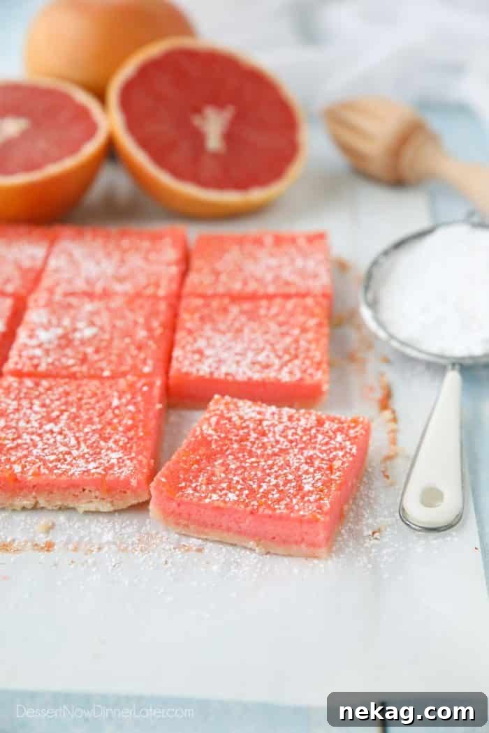 Grapefruit bars (just like lemon bars) cut into squares with a dusting of powdered sugar on top.